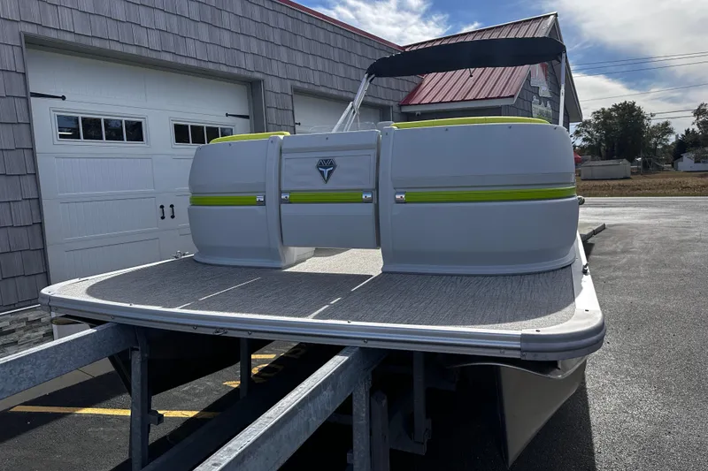 Slide: The Image of 2025 Avalon 2185 Aura Quad Lounge Twin Toon pontoon boat on trailer. - 4