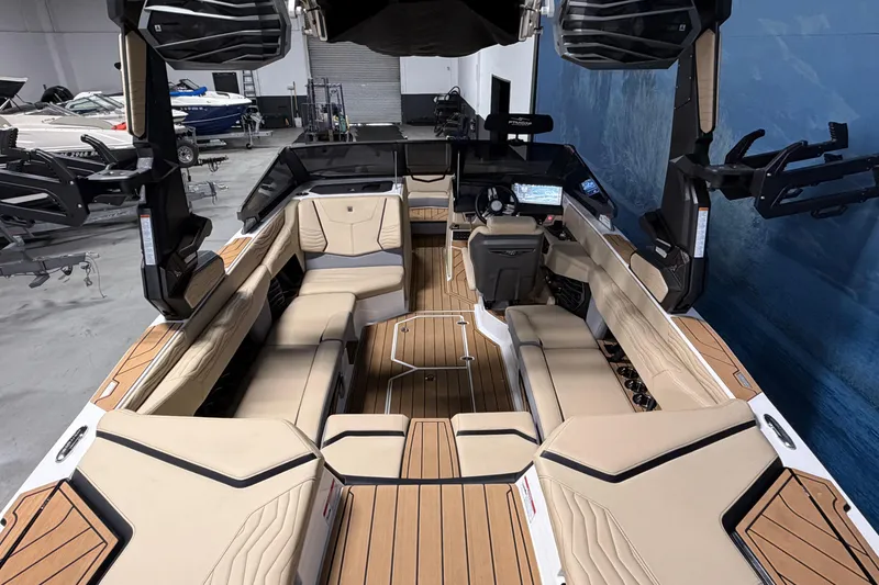 Slide: The Image of 2025 Nautique Super Air Nautique G23 interior with luxurious seating and advanced dashboard. - 6