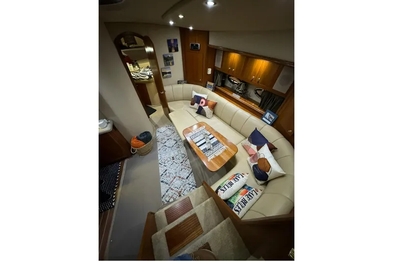 Slide: The Image of Luxurious interior of 2003 Cruisers Yachts 4370 Express with cozy seating and elegant decor. - 14