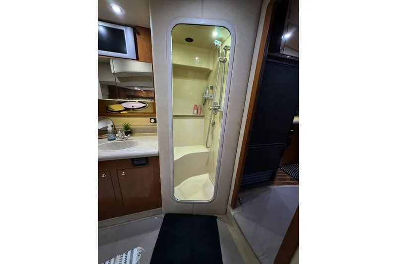 Slide: The Image of Luxurious bathroom interior of 2003 Cruisers Yachts 4370 Express with shower and vanity. - 18