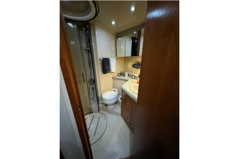 Slide: The Image of Bathroom interior of 2003 Cruisers Yachts 4370 Express with shower and vanity. - 26