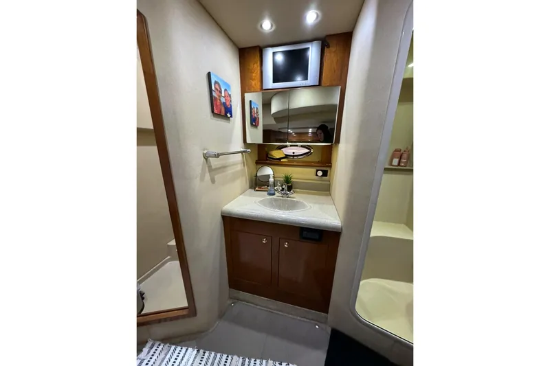 Slide: The Image of Luxurious bathroom in 2003 Cruisers Yachts 4370 Express with modern fixtures and decor. - 27