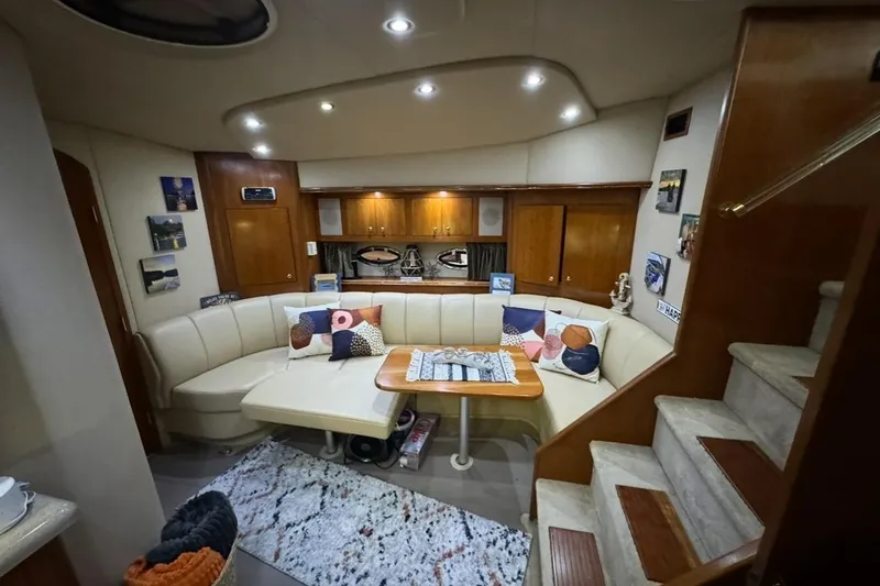 Slide: The Image of Luxurious interior of 2003 Cruisers Yachts 4370 Express with cozy seating and elegant decor. - 15