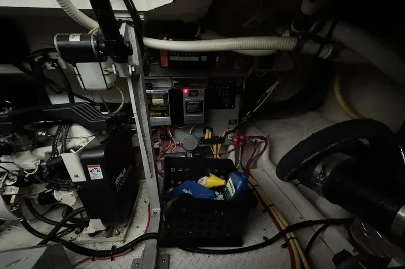 Slide: The Image of Engine room of 2003 Cruisers Yachts 4370 Express with mechanical components and wiring. - 28