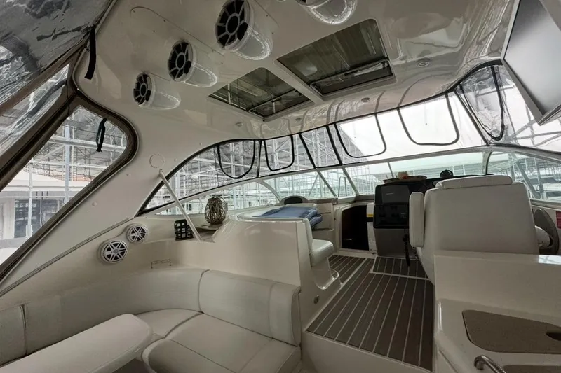 Slide: The Image of Interior of 2003 Cruisers Yachts 4370 Express, featuring sleek seating and modern controls. - 6