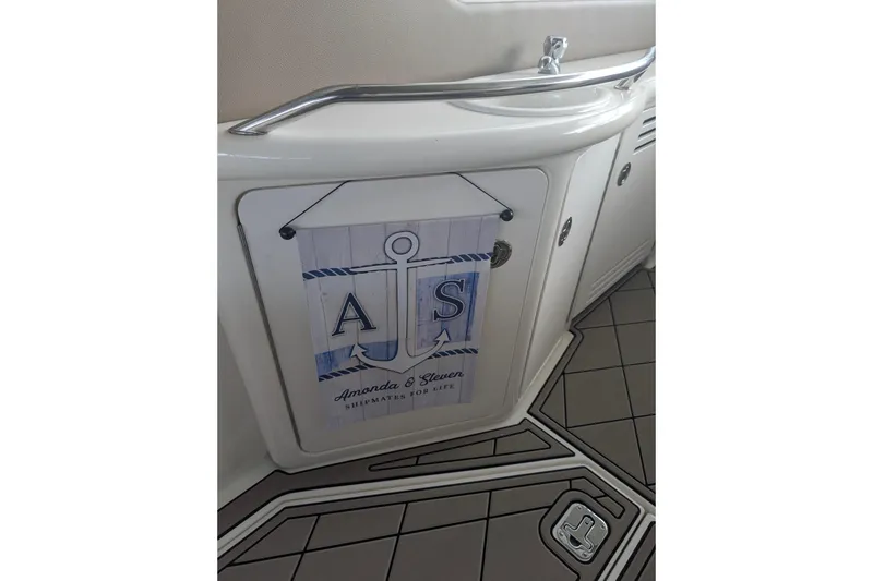 Slide: The Image of 2000 Sea Ray 380 Sundancer interior with personalized nautical decor and anchor design. - 15
