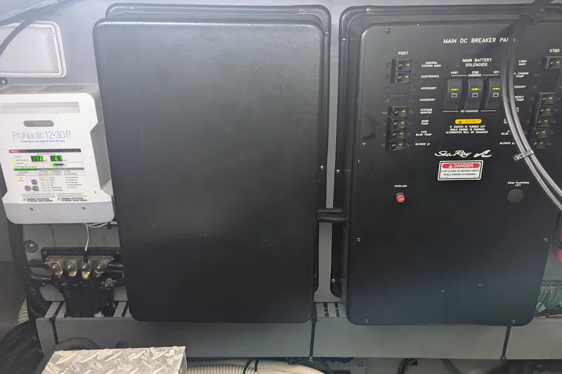 Slide: The Image of Electrical panel of a 2000 Sea Ray 380 Sundancer boat, featuring ProNautic12:30P charger. - 19