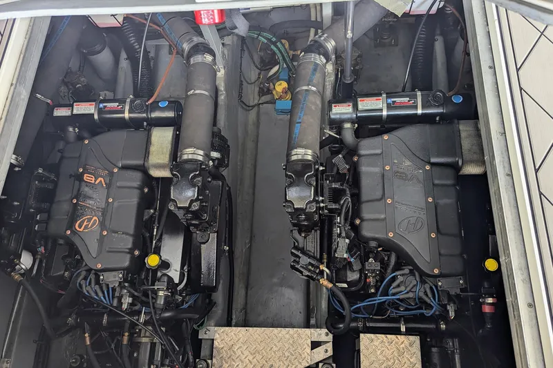 Slide: The Image of Engine compartment of a 2000 Sea Ray 380 Sundancer with dual V8 engines. - 21