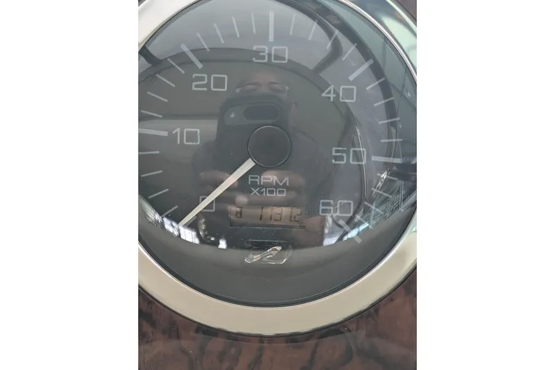 Slide: The Image of Close-up of a Sea Ray 380 Sundancer 2000 RPM gauge, showing reflections. - 5
