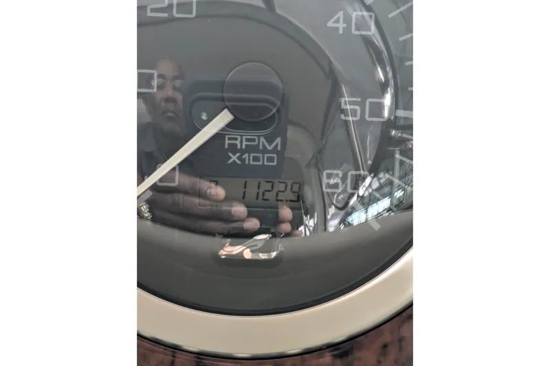 Slide: The Image of Close-up of Sea Ray 380 Sundancer 2000 RPM gauge displaying 11229 hours. - 6