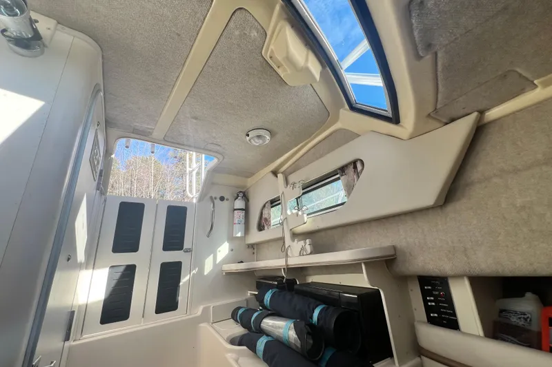 Slide: The Image of Interior cabin of 1999 Grady-White Islander 268 boat with skylight and storage. - 13