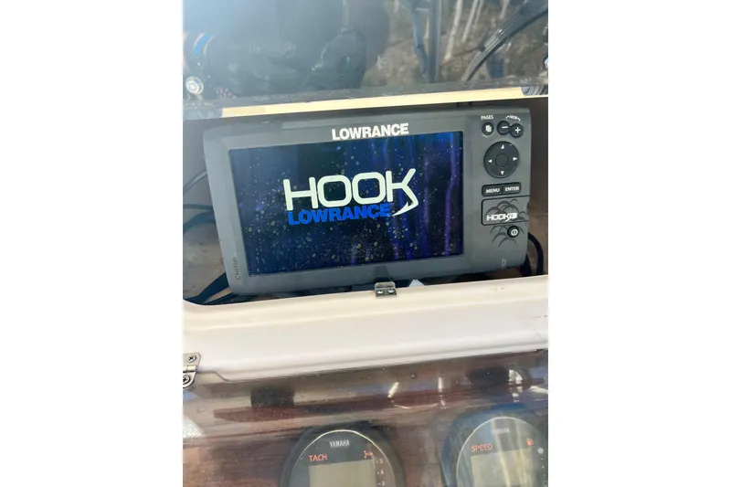 Slide: The Image of Lowrance Hook fishfinder on 1999 Grady-White Islander 268 boat dashboard. - 18