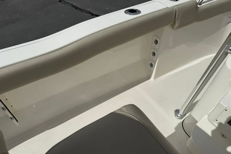 Slide: The Image of Interior view of a 2022 Key West 203 FS boat, featuring seating and rod holders. - 12