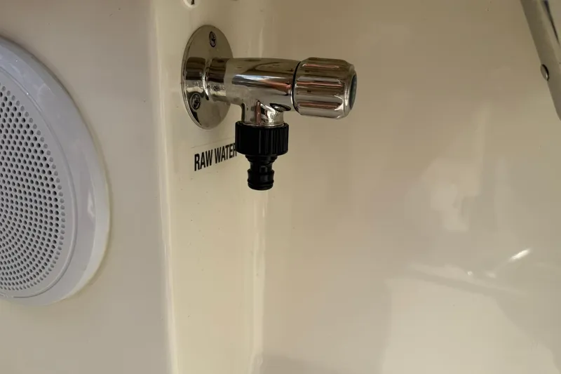 Slide: The Image of 2022 Key West 203 FS boat raw water outlet and speaker detail. - 13