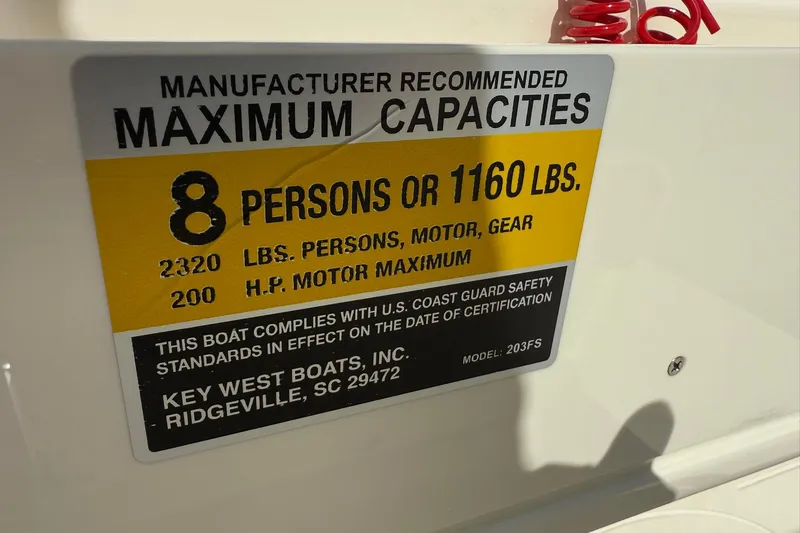 Slide: The Image of Key West 203 FS 2022 boat capacity label: 8 persons or 1160 lbs, 200 HP motor max. - 14
