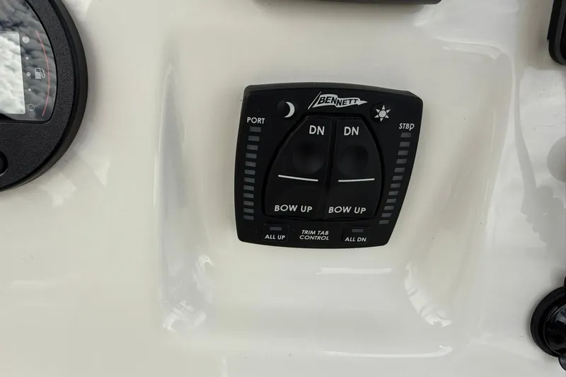 Slide: The Image of Bennett trim tab control panel on 2022 Key West 203 FS boat dashboard. - 20
