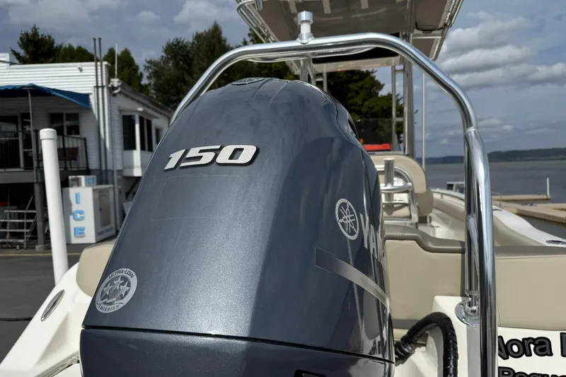 Slide: The Image of 2022 Key West 203 FS boat with Yamaha 150 engine at dockside. - 4