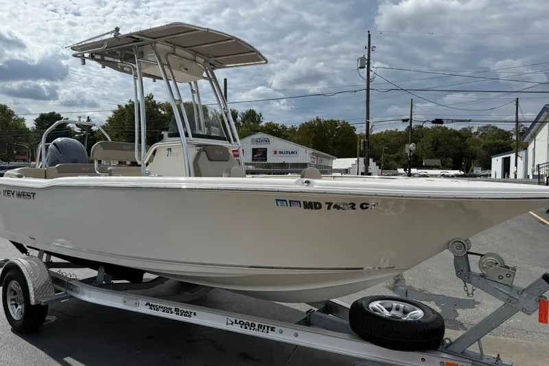 Slide: The Image of 2022 Key West 203 FS boat on trailer under cloudy sky. - 6