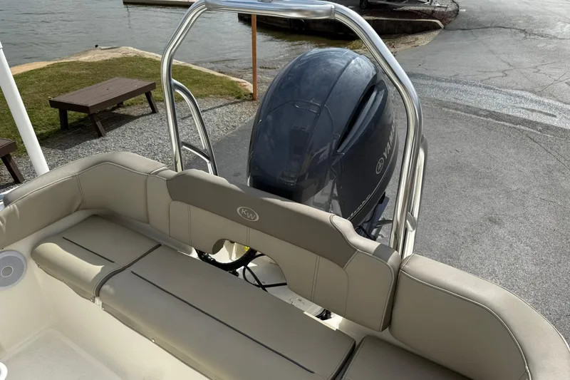 Slide: The Image of 2022 Key West 203 FS boat with Yamaha engine, docked near a lake. - 8