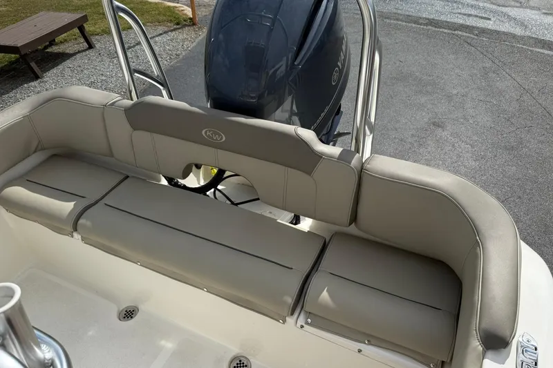 Slide: The Image of 2022 Key West 203 FS boat with beige seating and Yamaha outboard motor. - 9