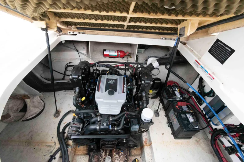 Slide: The Image of Engine compartment of a 2009 Sea Ray 250 Sundancer boat, featuring a 350 MAG engine. - 13