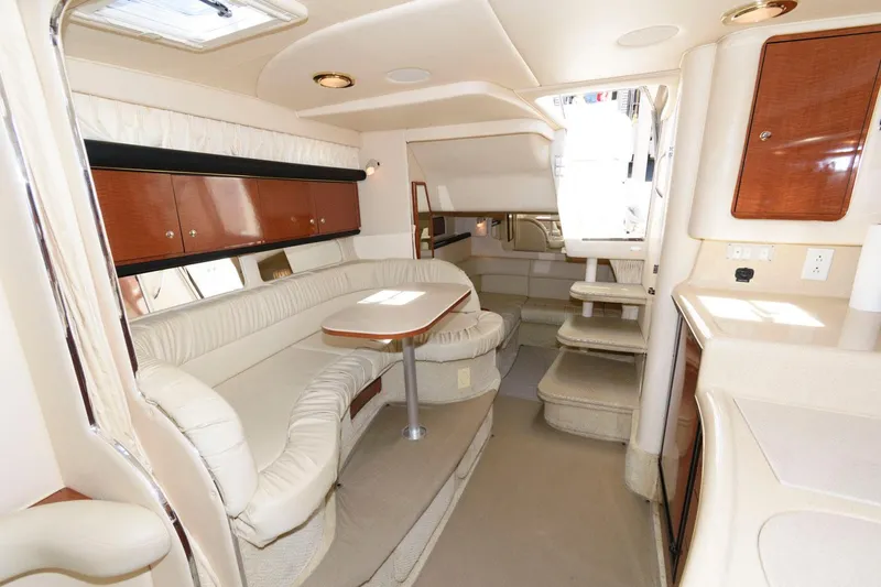 Slide: The Image of Luxurious 2002 Sea Ray 340 Sundancer yacht kitchen with wood cabinetry and modern appliances. - 11