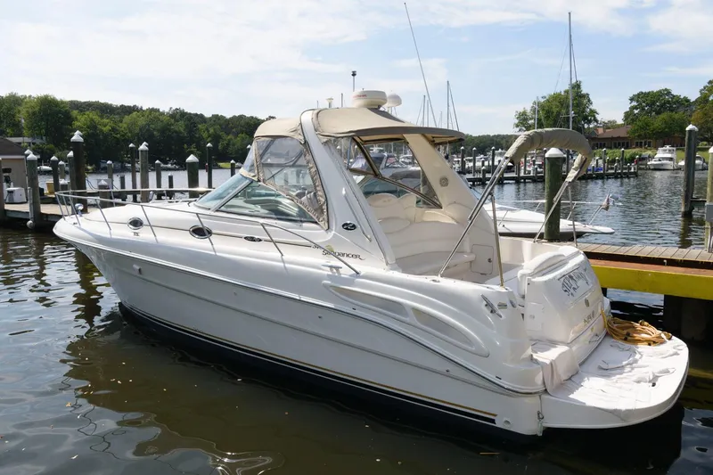 Slide: The Image of 2002 Sea Ray 340 Sundancer docked near waterfront homes. - 3