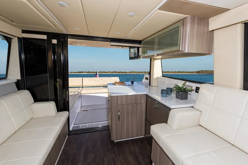Slide: The Image of Manufacturer Provided Image: Interior of 2020 Regal 38 XO yacht with modern kitchen and scenic water view. - 13