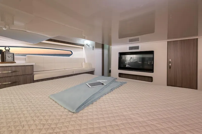 Slide: The Image of Manufacturer Provided Image: Luxurious interior cabin of a 2020 Regal 38 XO yacht with modern furnishings. - 18