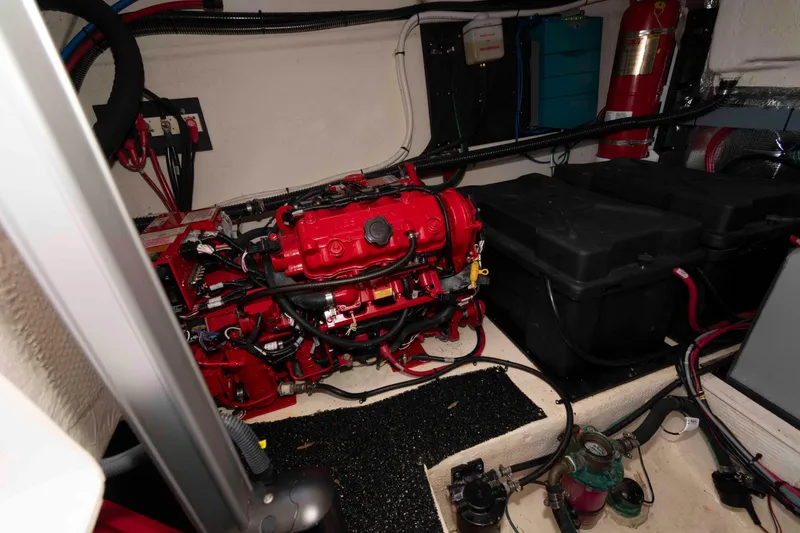 Slide: The Image of Engine room of 2020 Regal 38 XO boat with red engine and equipment. - 26