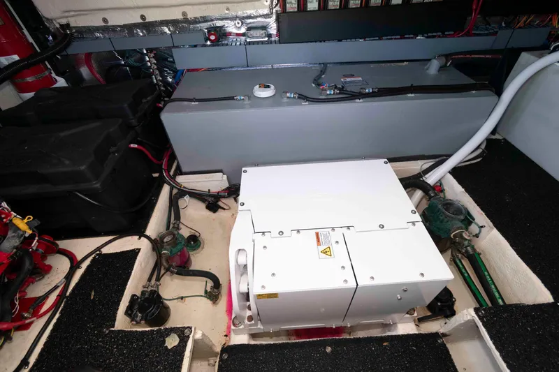 Slide: The Image of Engine compartment of a 2020 Regal 38 XO boat, showcasing mechanical components and wiring. - 27