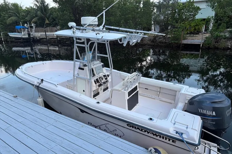 Slide: The Image of 2000 Grady-White Fisherman 222 boat docked, featuring Yamaha outboard motor. - 3