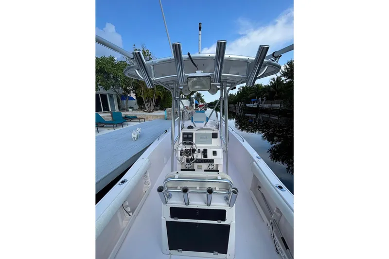 Slide: The Image of Grady-White Fisherman 222 boat, 2000 model, docked by a serene waterfront. - 4