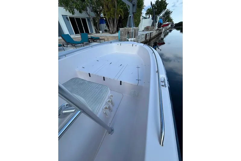 Slide: The Image of 2000 Grady-White Fisherman 222 boat docked by a waterfront home. - 8