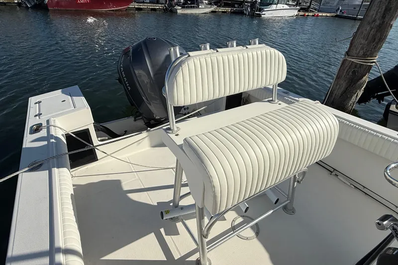 Slide: The Image of 2001 Regulator 23 Classic boat with Yamaha engine, docked at marina. - 10