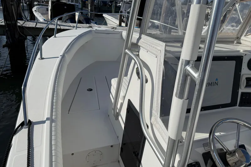 Slide: The Image of 2001 Regulator 23 Classic boat interior with steering wheel and navigation equipment. - 7