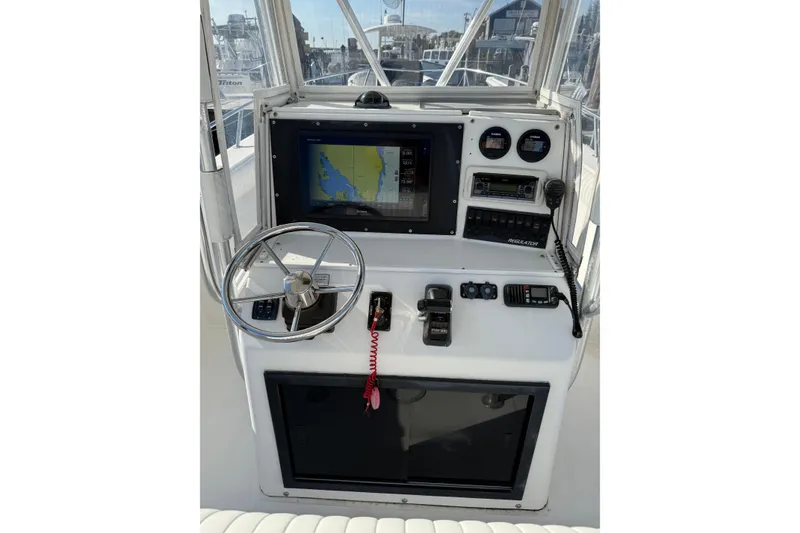 Slide: The Image of Control panel of a 2001 Regulator 23 Classic boat with navigation equipment. - 8