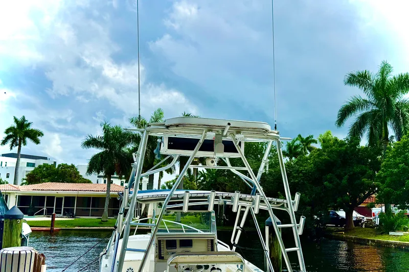 Slide: The Image of 1993 Marlin 35 CC Sportfish boat tower with palm trees in background. - 21
