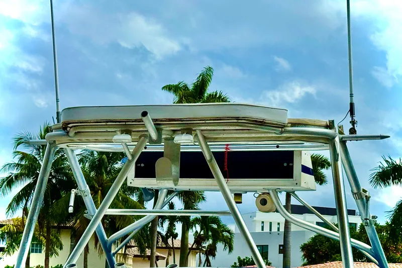 Slide: The Image of 1993 Marlin 35 CC Sportfish boat interior with dual engines and seating. - 22