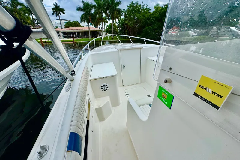 Slide: The Image of 1993 Marlin 35 CC Sportfish boat with cuddy cabin, docked near waterfront property. - 26