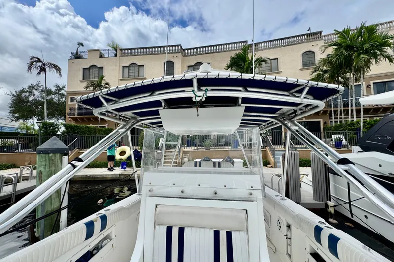 Slide: The Image of 1993 Marlin 35 CC Sportfish boat interior with white seating and storage compartment. - 28