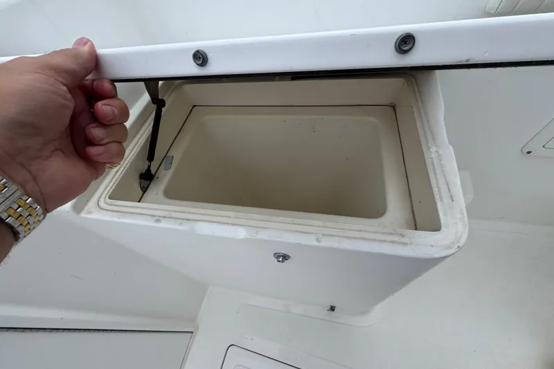 Slide: The Image of 1993 Marlin 35 CC Sportfish boat interior with storage compartments and seating. - 32