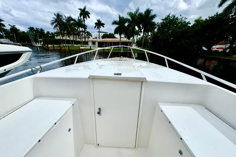 Slide: The Image of 1993 Marlin 35 CC Sportfish cuddy cabin interior with safety equipment and storage. - 34