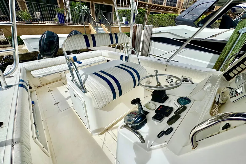 Slide: The Image of 1993 Marlin 35 CC Sportfish boat interior with striped seating and cuddy cabin. - 40