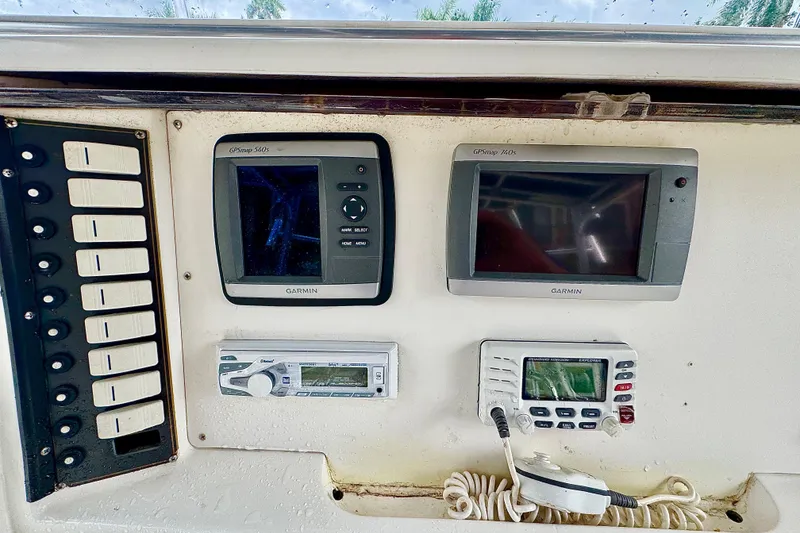 Slide: The Image of 1993 Marlin 35 CC Sportfish boat interior with steering console and seating. - 44
