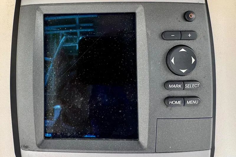 Slide: The Image of 1993 Marlin 35 CC Sportfish boat dashboard with control panel and Garmin GPS. - 46