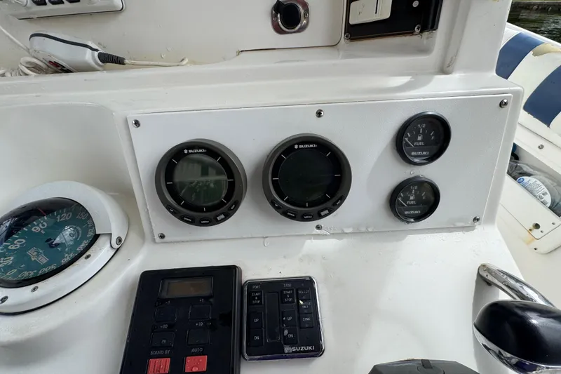 Slide: The Image of Open hatch on 1993 Marlin 35 CC Sportfish boat, revealing storage compartment. - 54