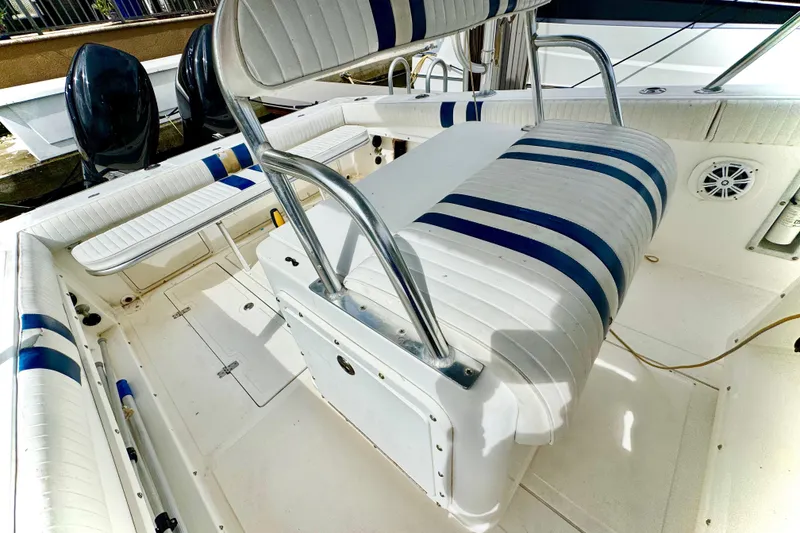 Slide: The Image of 1993 Marlin 35 CC Sportfish boat cockpit with steering wheel and control panel. - 56