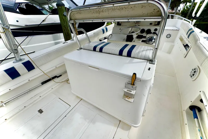 Slide: The Image of 1993 Marlin 35 CC Sportfish boat docked near waterfront homes. - 62