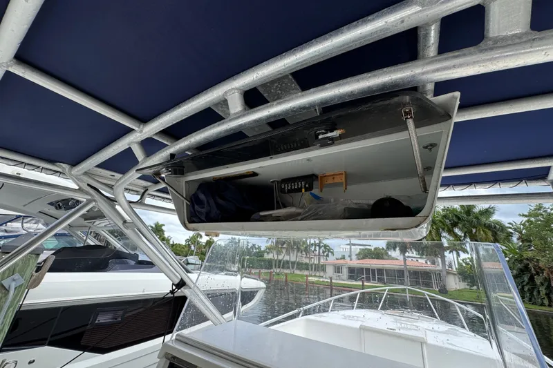 Slide: The Image of Suzuki engine display showing low battery voltage warning on Marlin 35 CC Sportfish, 1993 model. - 64